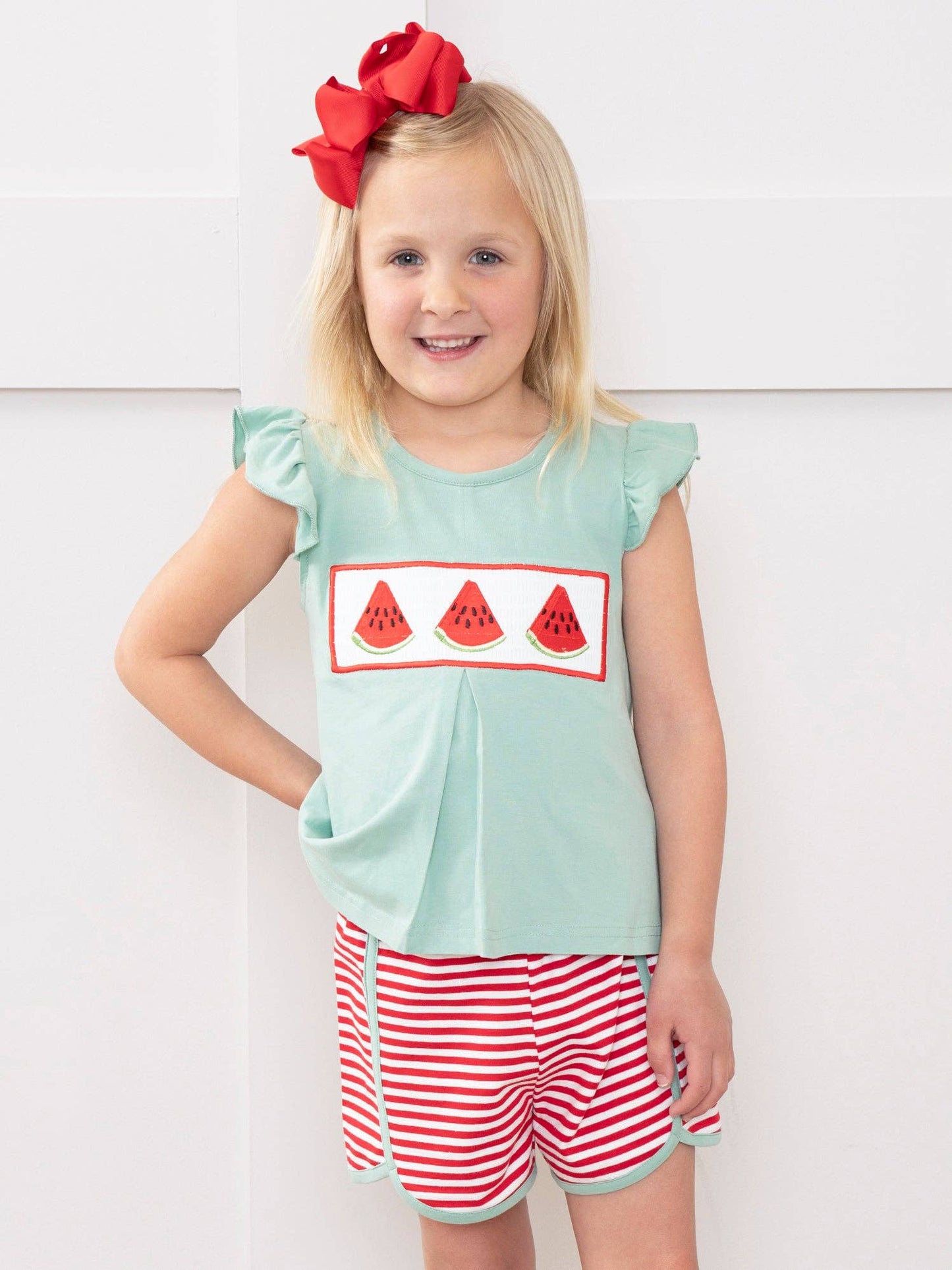 Watermelon Stripes Smocked Cotton Ruffle Outfit for toddler girls featuring ruffle smocked top with embroidered watermelon and matching striped shorts by Marie Nicole Clothing