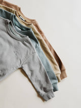 Stone Gray Relaxed Sweatshirt by Orcas Lucille - Flat Lay