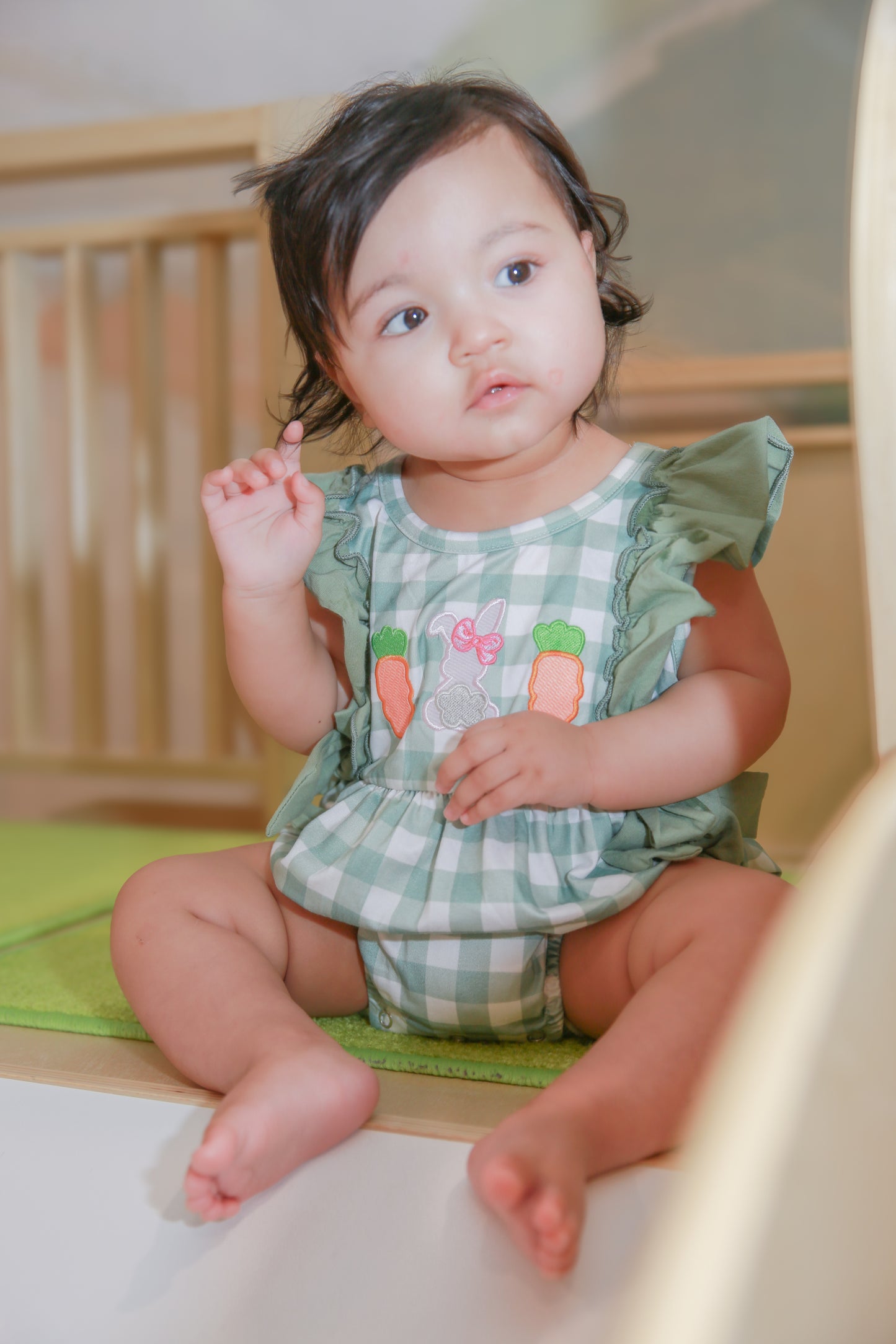 Baby girl model Logan wearing Gingham Carrot Patch Embroidered Bubble Romper - Easter outfit