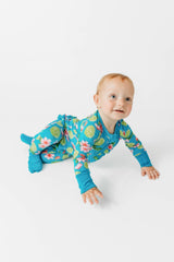 Flower and Lime Ruffle Butt Bamboo Footie Pajamas - Side View Baby Crawling - Fold-Over Cuffs and Footed Design