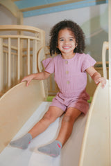 Lucy Soft Sherbert Organic Muslin Cap-Sleeve Romper by The Honey and Bro Co. - Back View