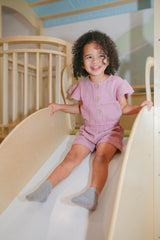 Lucy Soft Sherbert Organic Muslin Cap-Sleeve Romper by The Honey and Bro Co. - Back View