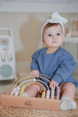 The Marley Organic Bubble Romper | Cornflower by The Honey and Bro Co. - Lifestyle View