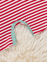 Close-up detail of smocked bodice with embroidered watermelon on baby girl cotton romper by Marie Nicole Clothing