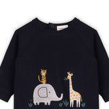 Back view of navy safari jumpsuit showing snap closure convenience and organic cotton construction