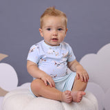 Baby wearing Taking Flight airplane organic cotton bodysuit