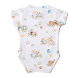 Flopsy Bunnies organic bodysuit flat lay with Easter accessories