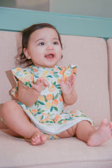 Baby girl model Logan wearing Citrus Squeeze Organic Cotton Short Sleeve Dress