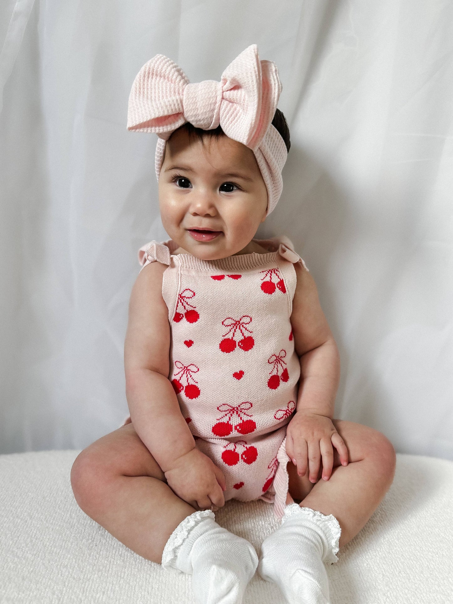 Summer Cherry Heart Bow Frill Romper by The Honey and Bro Co - Front View