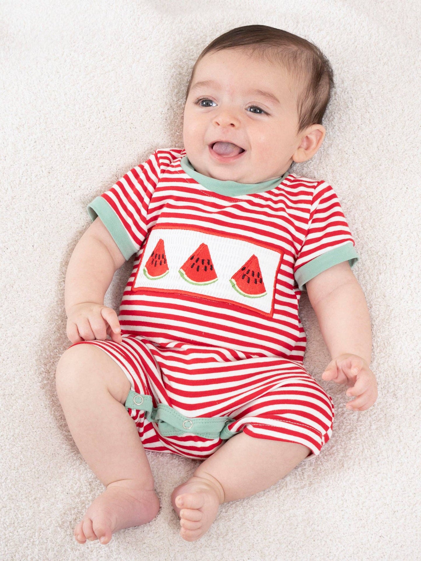 Watermelon Stripes Smocked Cotton Romper for baby girls featuring hand-smocked bodice with embroidered watermelon detail and red green stripes by Marie Nicole Clothing