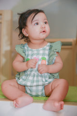 Baby girl model Logan wearing Gingham Carrot Patch Embroidered Bubble Romper - Easter outfit