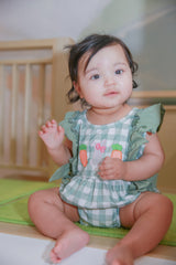 Baby girl model Logan wearing Gingham Carrot Patch Embroidered Bubble Romper - Easter outfit