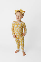 Sunny Daisy Bamboo Two-Piece Pajama Set - Side Angle on Girl - Yellow Floral Bamboo Pajamas with White Trim