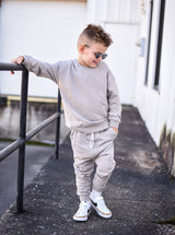 Toddler Stone Gray Drawstring Relaxed Joggers by The Honey and Bro Co. - Lifestyle View