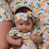 Citrus Squeeze Organic Cotton Topknot Headband - Side View on Baby