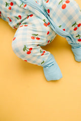 Cherry Picnic Bamboo Footed Sleeper Pajamas - On Baby
