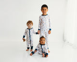 Children wearing Harbor Dreams Soluna bamboo pajamas and baby zippy in matching sailboat print