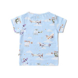 Back view flat lay of Taking Flight organic cotton t-shirt showing all-over watercolor airplane helicopter and cloud print