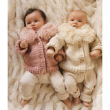 Baby wearing natural fur collar cardigan - lifestyle shot showing comfort and style for toddlers