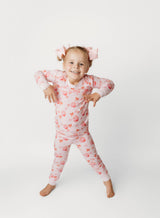 Cupcakes and Bows Bamboo Two-Piece Pajama Set - Front View on Toddler - Pink Cupcake Print Long Sleeve Pajamas