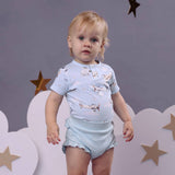 Baby in Taking Flight bodysuit with matching accessories