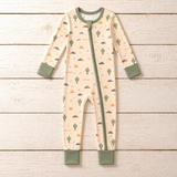 Desert Dawn Zippy by The Honey and Bro Co. - Bamboo zippy pajama flat lay with sage trim and cactus sunrise print