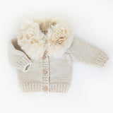 Baby cardigan sweater with fur collar in natural color - front view showing button closure by Huggalugs