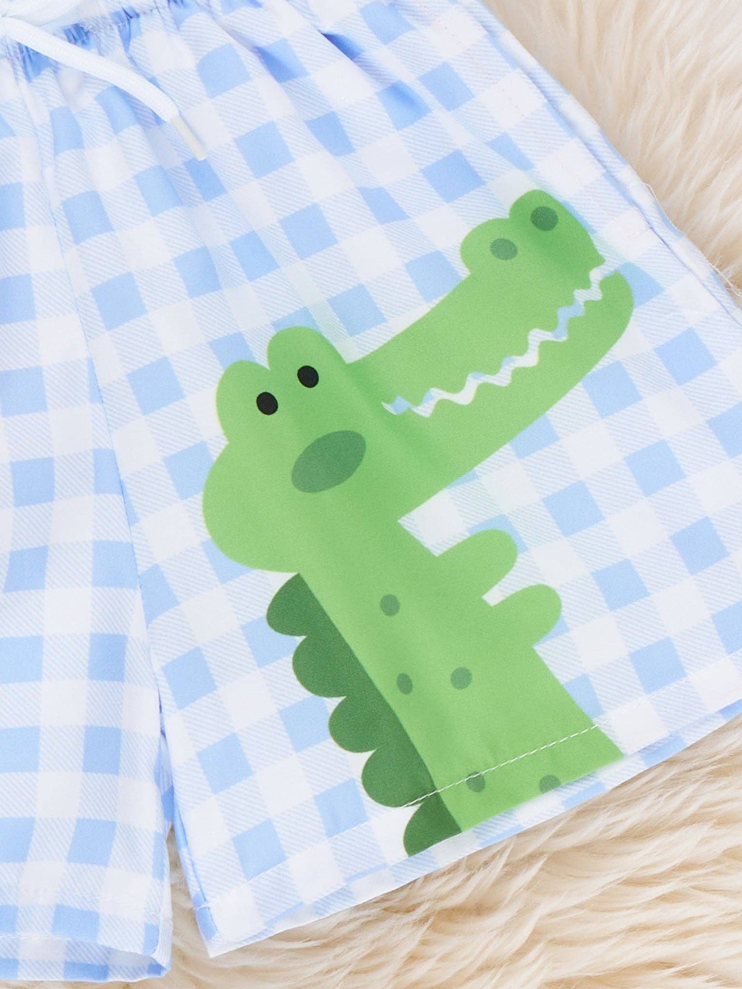 Back view of Gingham Gator Splash Trunk showing green gingham pattern and functioning pockets on boy swim trunks