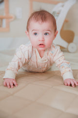 Baby girl model Logan wearing Bicycles Footless Sleep and Play Organic Cotton - vintage bicycle print