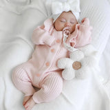Long Flutter Ribbed Romper | Pink by The Honey and Bro Co. - Detail View