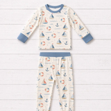 Harbor Dreams Long Sleeve Pajamas by The Honey and Bro Co. - Bamboo pajama set flat lay with dusty blue trim and nautical sailboat print