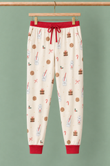Milk & Cookies Zinza™ Adult Pajama Jogger on wooden hangers against a sage background