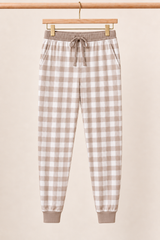 Mocha Gingham Zinza™ Adult Pajama Jogger on wooden hangers against a warm cream background