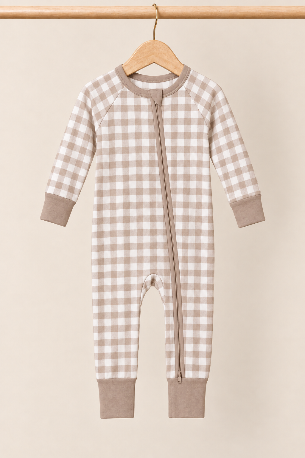 Mocha Gingham Zinza™ Convertible Zippy Pajama on wooden hangers against a warm cream background