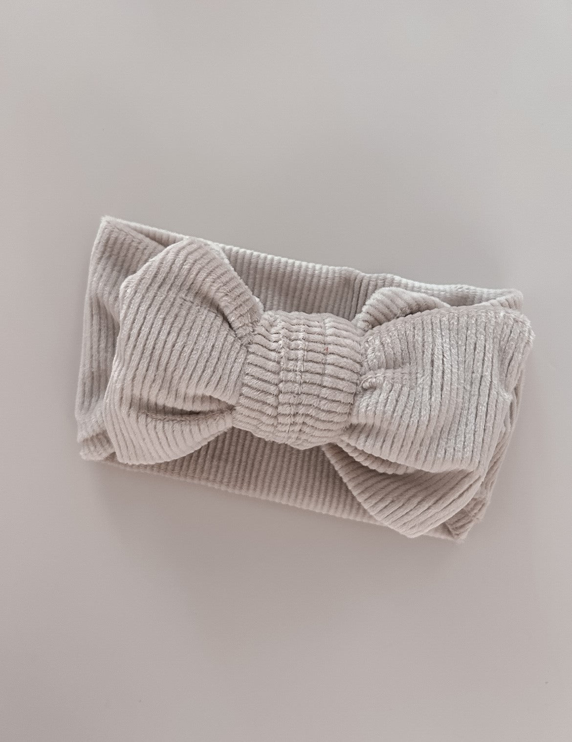 Chunky Velvet Ribbed Bow Headband Taupe close up - Petite + Co